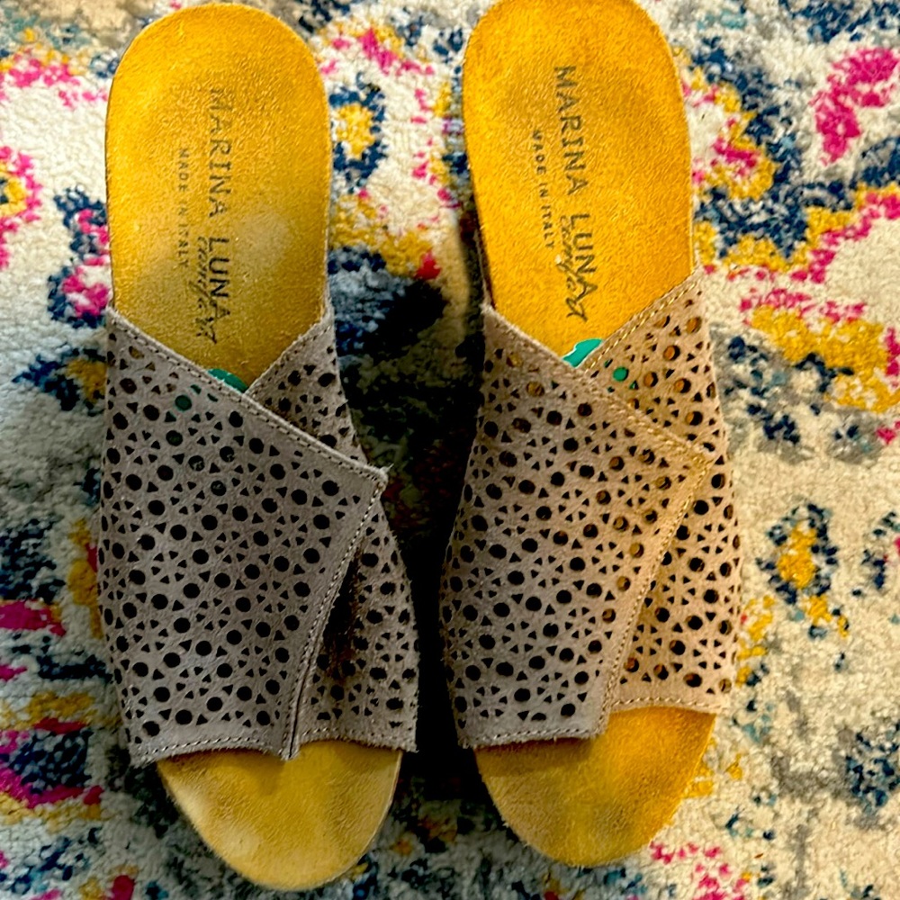 Beige slight wedge heel.